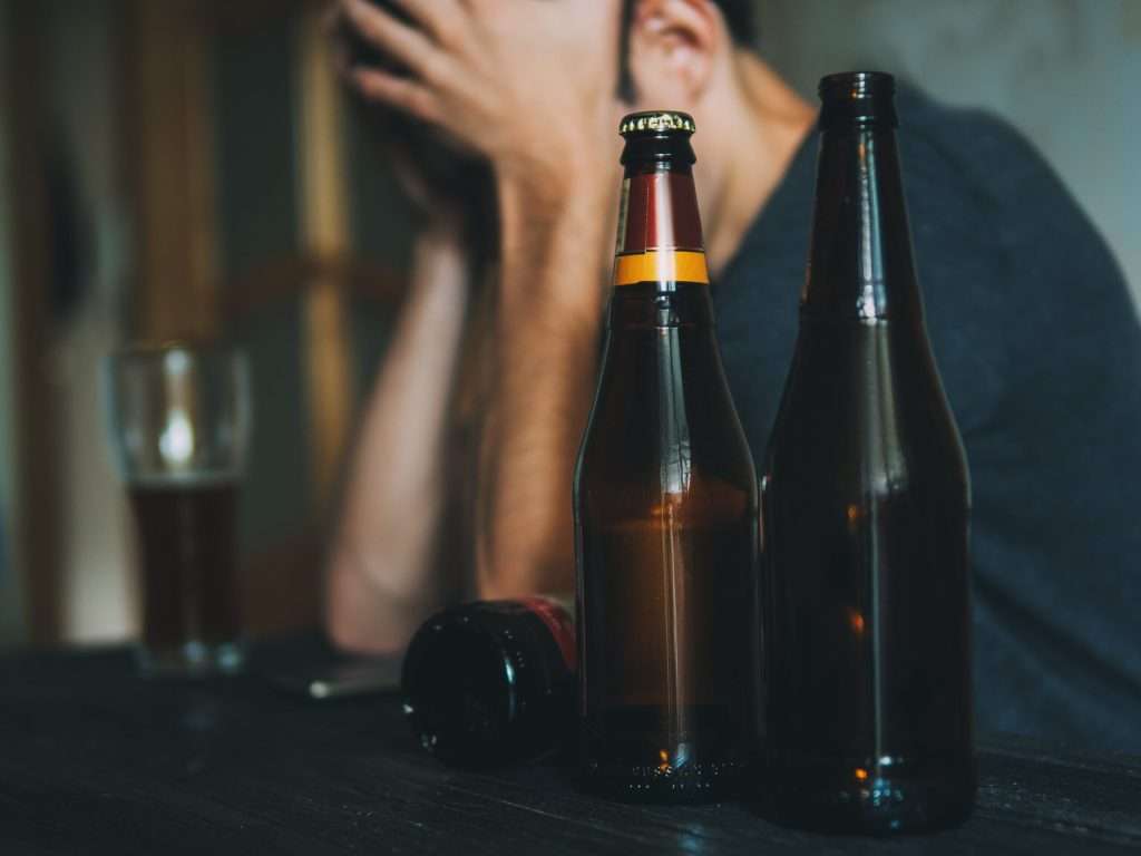 A person wondering: Is alcoholism a mental illness?