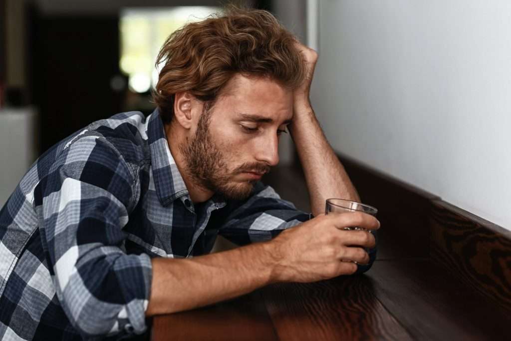 A man wondering: How long does it take to get addicted to alcohol?