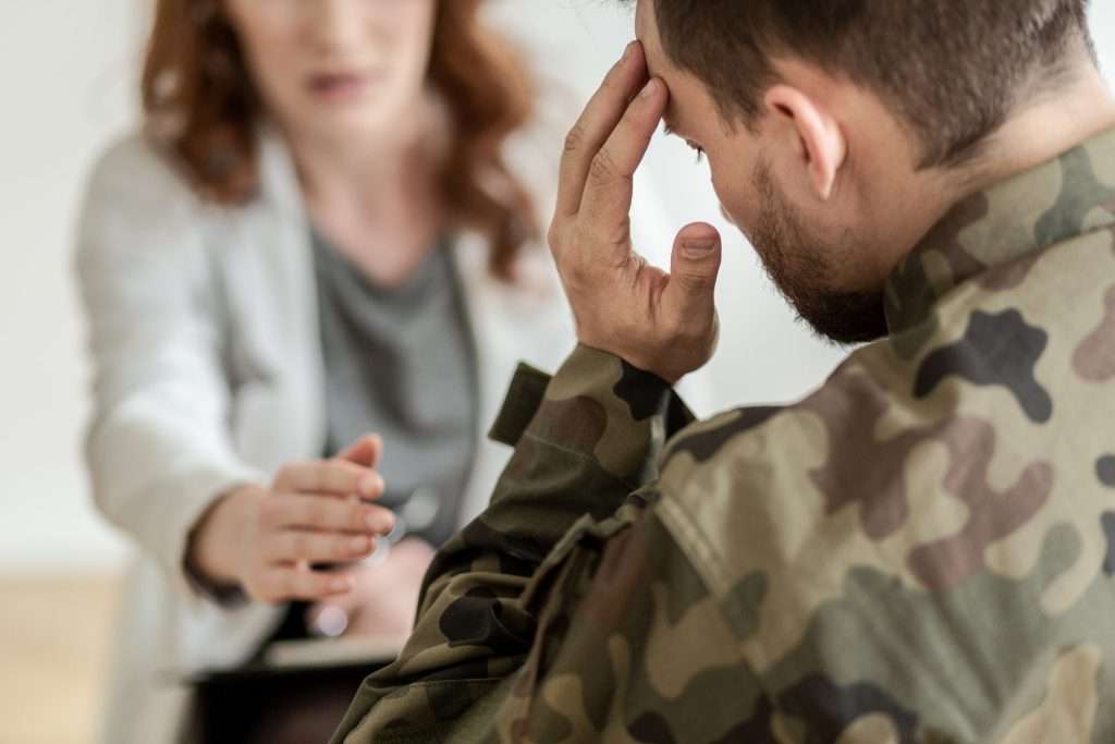 military service member in therapy during drug rehab