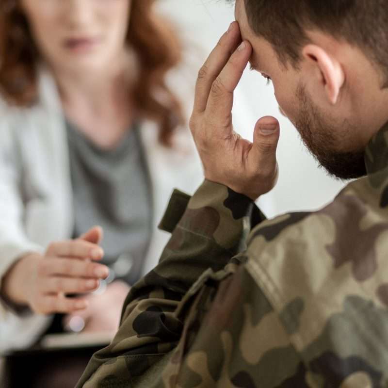 military service member in therapy during drug rehab