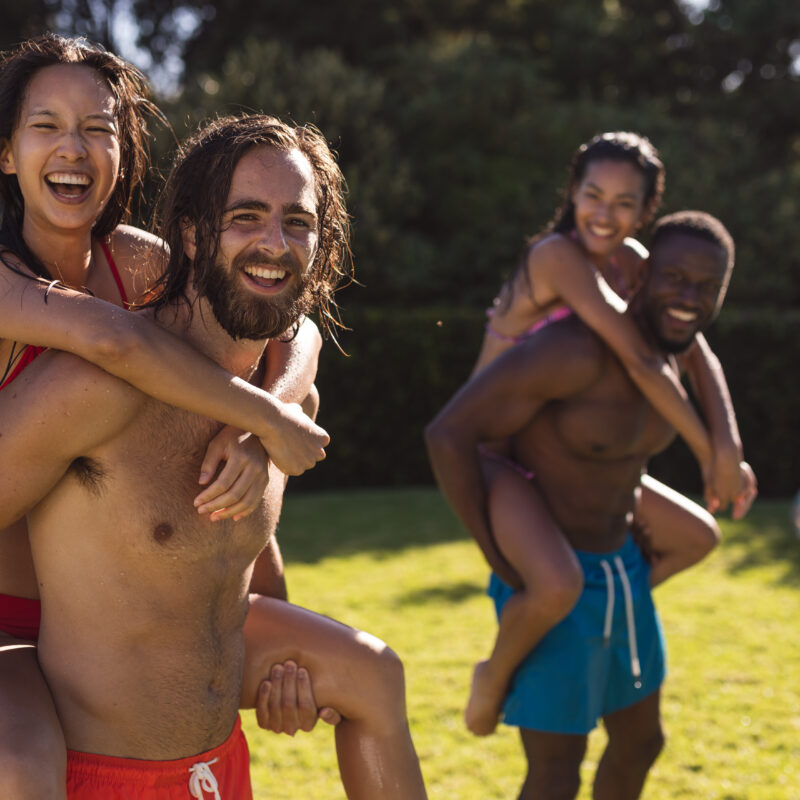 A group of shirtless friends smiling and enjoying themselves because they chose to pay for their rehab with insurance instead of free rehab.