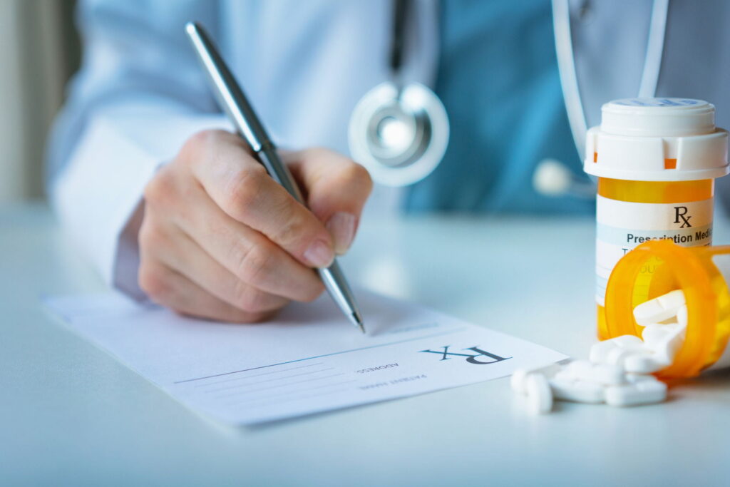 doctor writing prescription for medication-assisted treatment (MAT) in Tampa